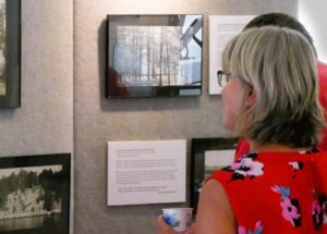 Viewing photos at the My Island Home Exhibit