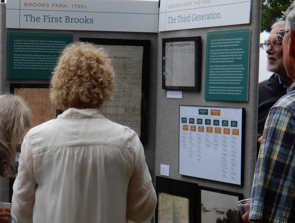 People viewing exhibit panel